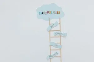 Creative mindfulness concept with ladder, words, and cloud shape for mental well
